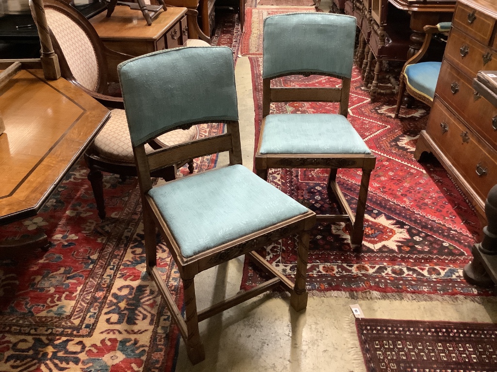 A set of six 1920's oak dining chairs two with arms